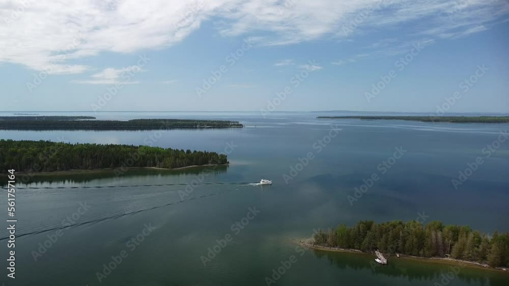 Aerial Shot of Lake Archipelago with Lone Yacht Boat - Les Cheneaux Islands, Michigan Aerial Shot of Lake Archipelago with Lone Yacht Boat - Les Cheneaux Islands, Michigan