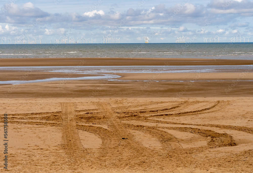 Fotografie Tractor patterns on Rhyll Beach, Wales, Uk