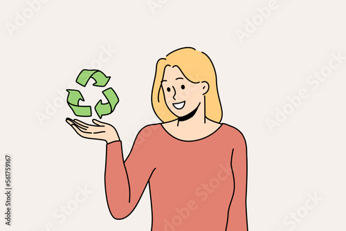 Smiling young woman holding recycle sign in hands care about planet conservation and protection. Happy female activist or volunteer with recycling symbol. Vector illustration. 