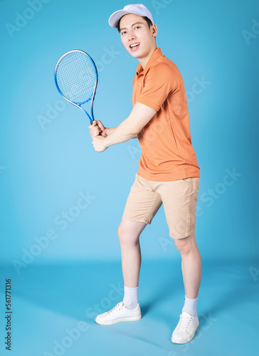 Image of young Asian man holding tennis racket © Timeimage