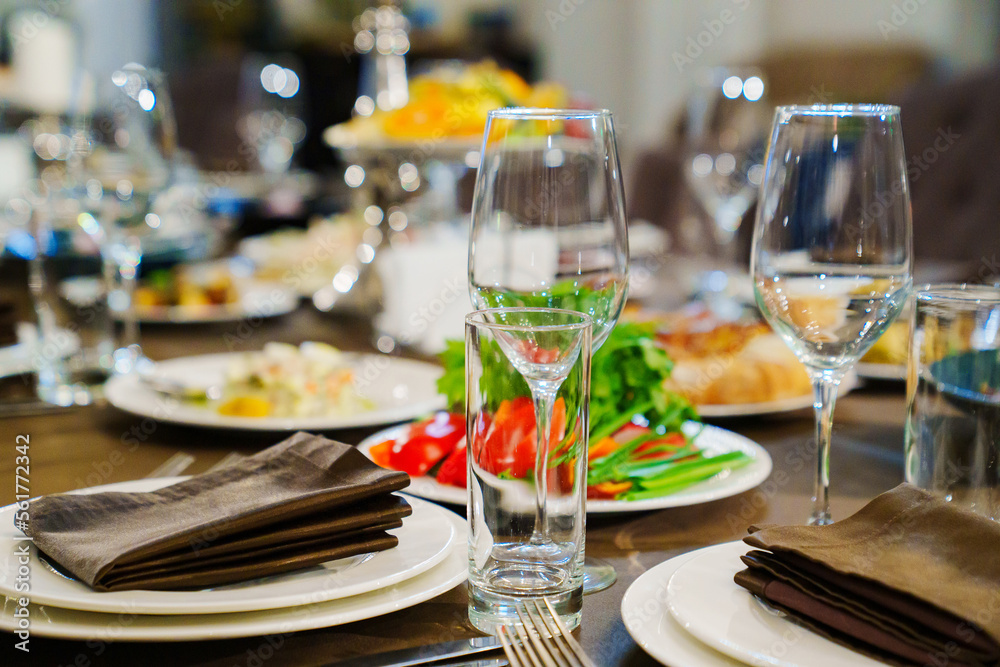 a festive served table with snacks and tableware.