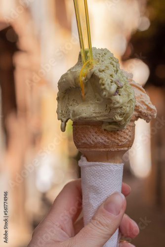 Italian ice cream in hand. fruit ice cream gelato in cone