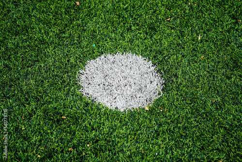 A penalty spot in football pitch
Background soccer pitch grass football stadium ground view. 