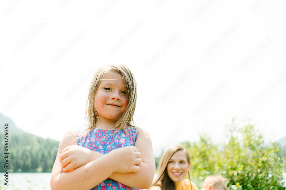 Straight on portrait of a young girl smiling at the camera Straight on portrait of a young girl smiling at the camera