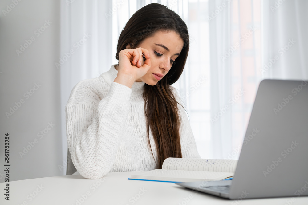 The tired and frustrated student feels stress before exams and problems with the project. Study at home. The tired and frustrated student feels stress before exams and problems with the project. Study at home.