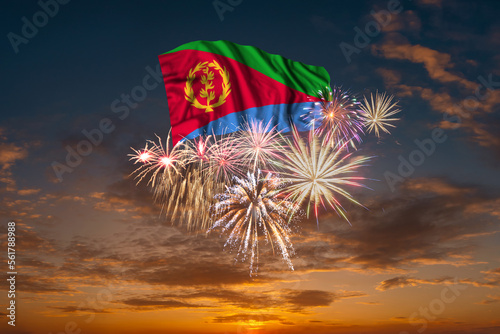 Flag of Eritrea and Holiday fireworks in sky photo