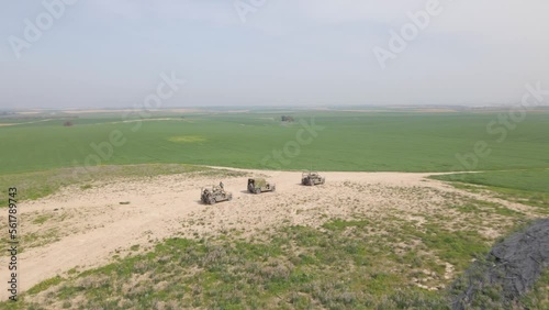 IDF Golani Infantry Squad Soldiers on Humvee Vehicles Stopped At Elevation At Training Ground in Israel, Aerial view photo