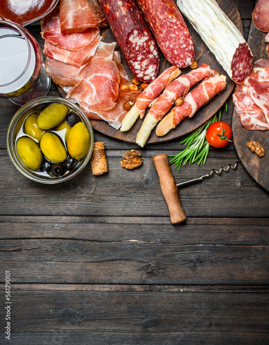 Antipasto background. Assortment of meat snacks on the Board .