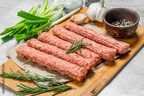 Raw beef sausages with garlic and herbs.
