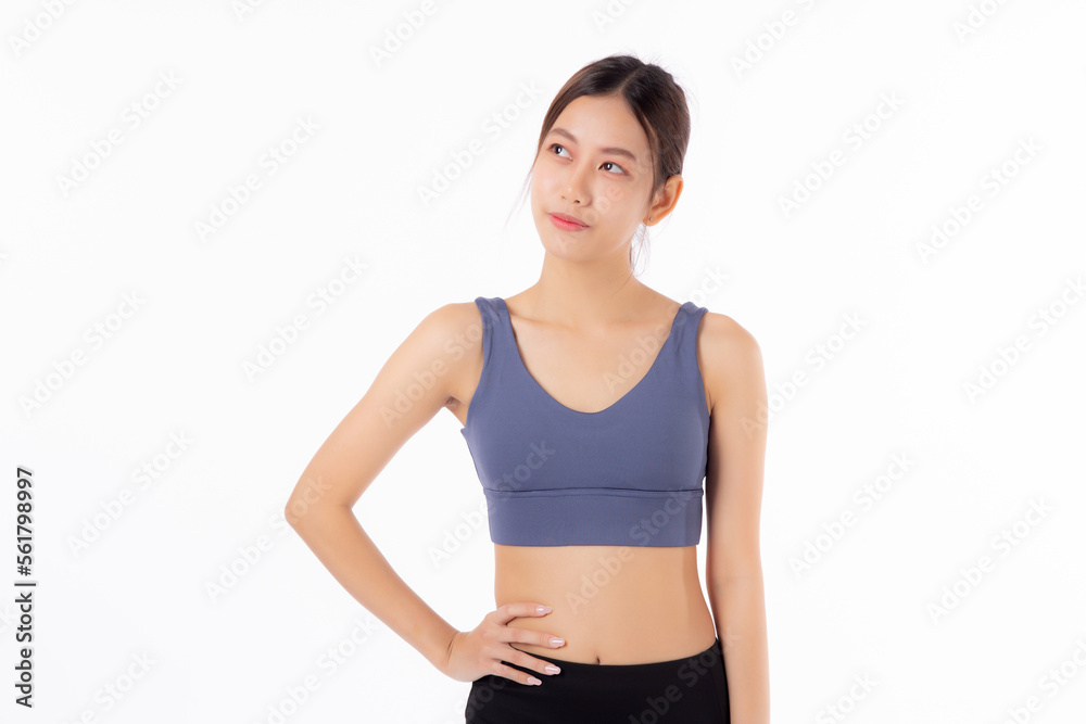 Portrait of beautiful young asian woman in sportwear smile and showing waist and abs isolated on white background, sport and exercise for health, female slimming with confident and wellness Portrait of beautiful young asian woman in sportwear smile and showing waist and abs isolated on white background, sport and exercise for health, female slimming with confident and wellness