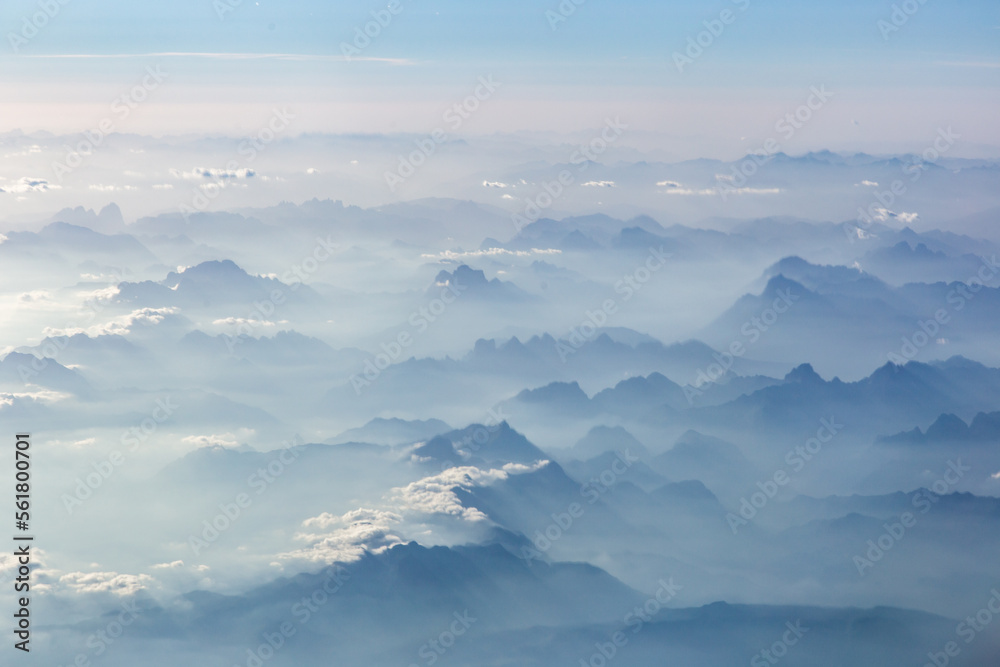 Aerial view of morning sunlight on Summer Alps. 