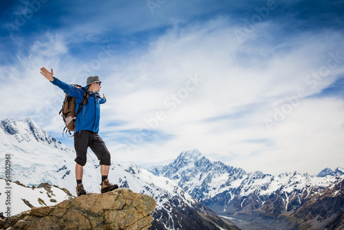 Hiker with backpack on the mountain top. Sport and active life concept