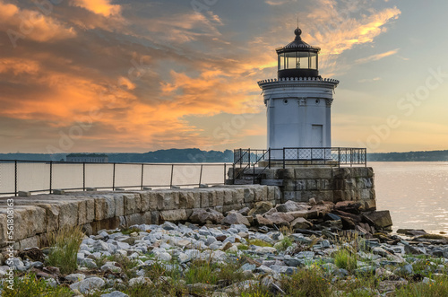 Portland Breakwater Light (also called Bug Light) in South Portland at dawn with yellow and orange colored sky, Maine, New England, USA