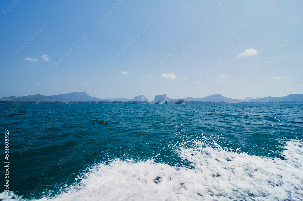 Sailing the sea. Seascape with rocks at blue sea. Travel by Thailand.