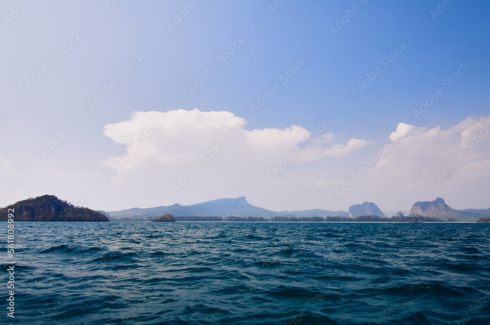 Sailing the sea. Seascape with rocks at blue sea. Travel by Thailand.