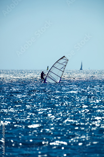 Windsurfer on the open sea ocean waters.