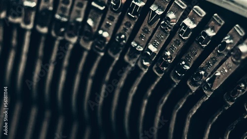 Letters and numbers in the typo keys of a old typewriter typing on a retro writing machine, close up