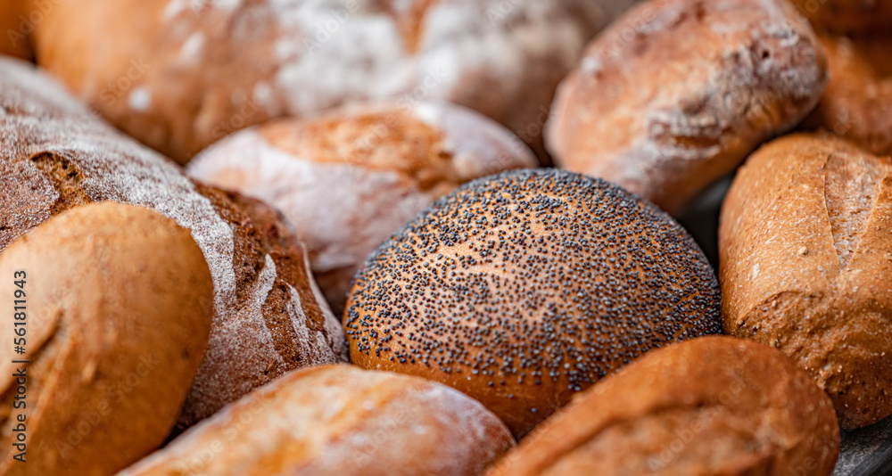 Freshly baked natural bread is on the kitchen table.