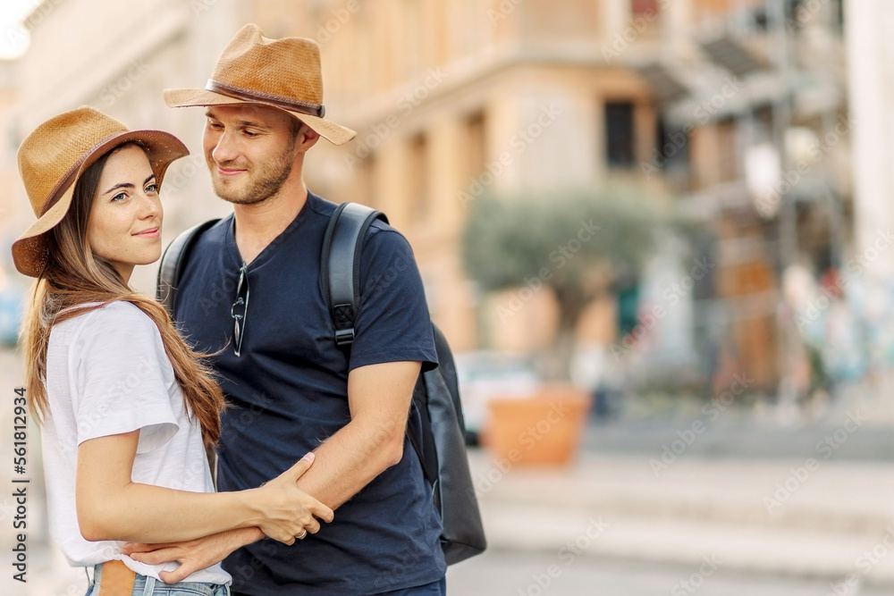 Happy Portrait of a happy young couple. A couple in love smiles and dreams. Valentine's Day. cheerful young couple in casual clothes traveling the world. romance and adventure. Tourists in love