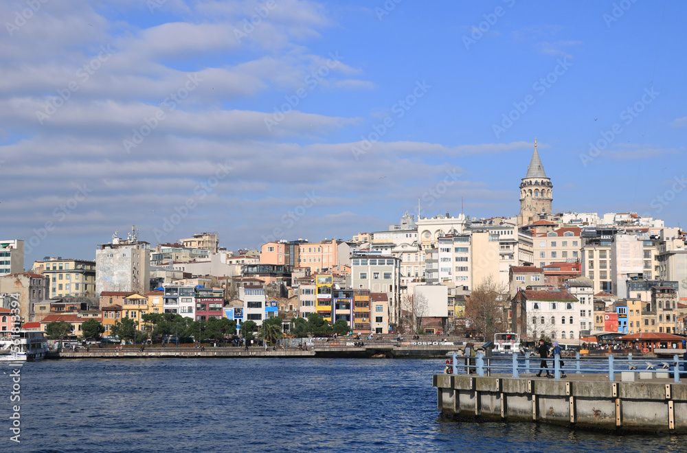 The Galata Tower and The Golden Horn in a cloudy day in Istanbul, Turkey.