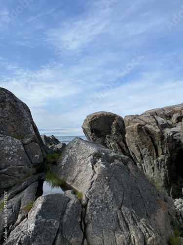 Amazing rocky ocean bay, rocky coast, huge stones, seascape, cloudy sky, Nordic seascape © Oksana