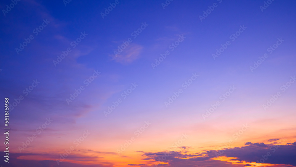 Colorful dusk sky with yellow sunlight and Sunset cloud on dark blue Twilight sky background