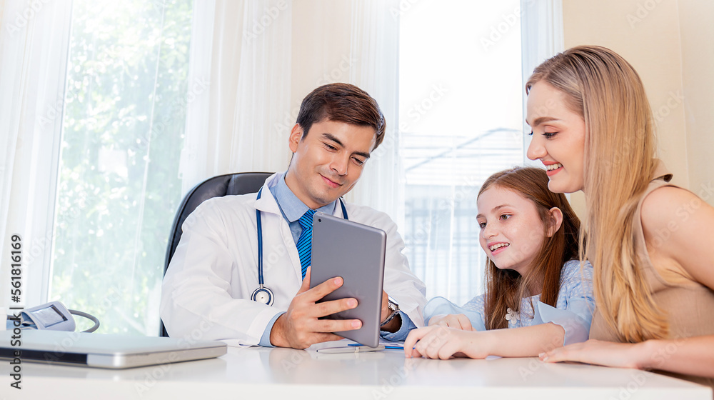 Caucasian doctor having conversation with little girl mother parent patient, holding ipad gadget in medical office. Doctor intern ( woman ) explaining x-ray results to patient Caucasian doctor having conversation with little girl mother parent patient, holding ipad gadget in medical office. Doctor intern ( woman ) explaining x-ray results to patient