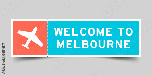 Orange and blue color ticket with plane icon and word welcome to melbourne on gray background