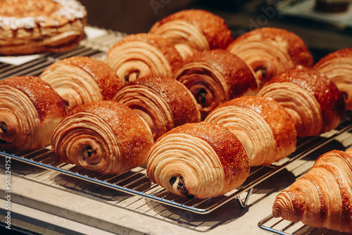 Close-up of fresh and beautiful pain au chocolats in a bakery showcase.