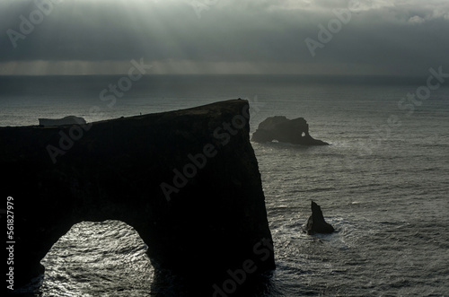 Dyrholaey Area in Iceland. Close to Black Sand Beach. Sunrise. Rocks in Background. Cloudy Sky.