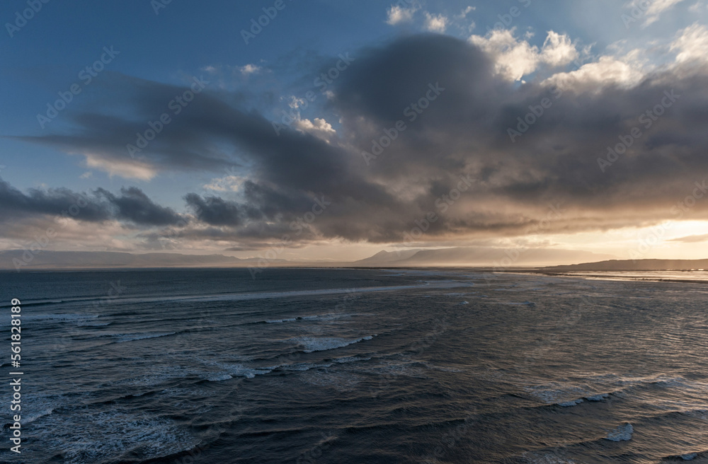 Iceland Landscape with Ocean Water and Clouds in Background