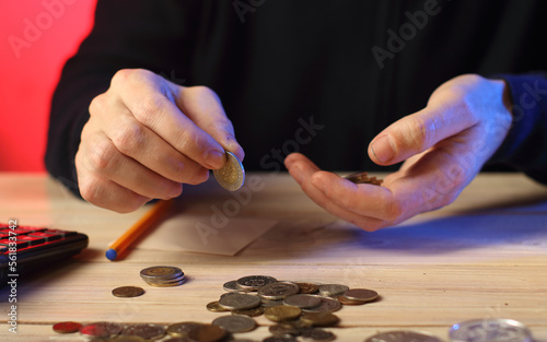 counting coins by a person on a table