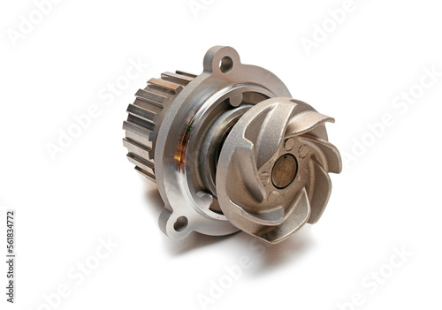 Metal coolant pump with impeller closeup isolate on white background. Water pump circulates coolant through the engine block. Metal car spare part