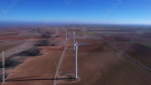 flight over turbines close to crop fields