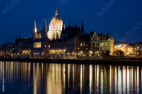 the Parliament Building at night, Budapest, Hungary, with lights reflected in the Danube. © Wildwatertv