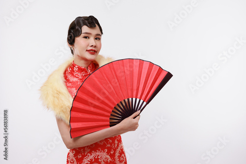 Young beautiful woman in chinese traditional dress on white isolated background.