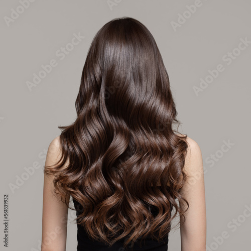 Portrait of a beautiful girl with luxurious curly long hair Fototapet