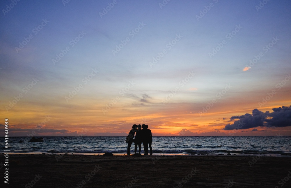 Fantastic sunset shared by four girls friends travelers in Thailand