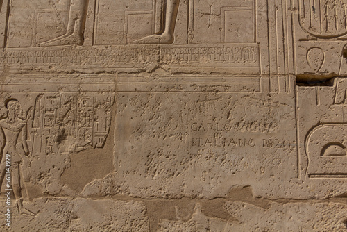 LUXOR, EGYPT - FEB 18, 2019: Wall detail of Ramesseum (Mortuary temple of Ramesses II) at the Theban Necropolis, Egypt. Inscription Carlo Italiano 1820.