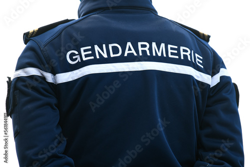 Fototapeta A policeman (gendarme from gendarmerie) from the back with uniform ensuring security in Paris, France