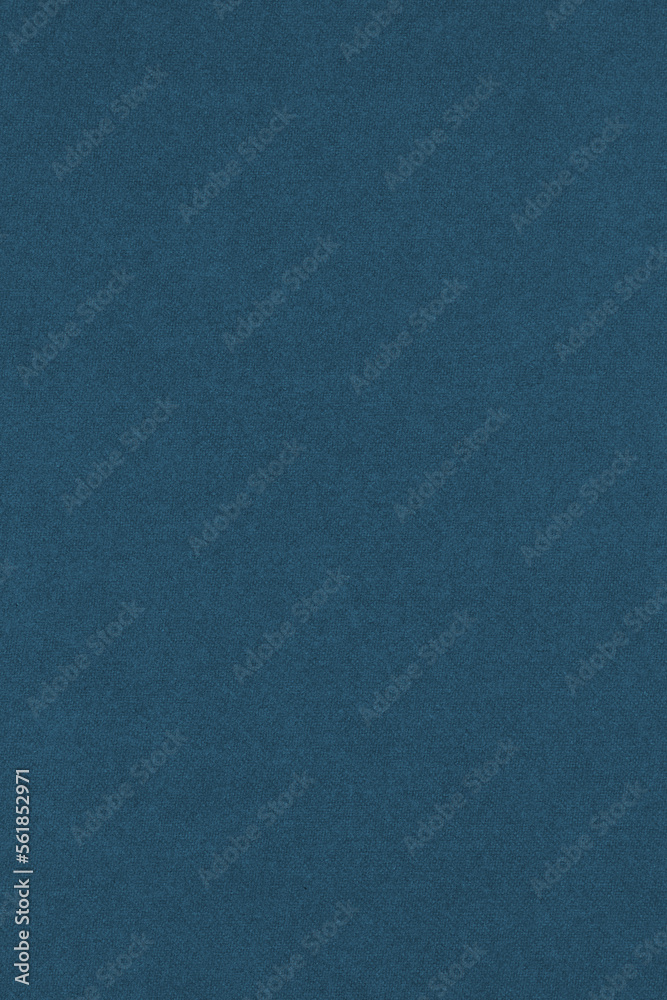 Dark blue colored paper texture. Tinted vertical background. Textured wallpaper. Large patterned surface. Fibers and irregularities are visible. Top-down