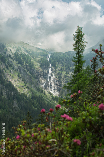 huge waterfall in the Reisseck group of the high tauern mountain range in carinthia during a beautiful summer hike.