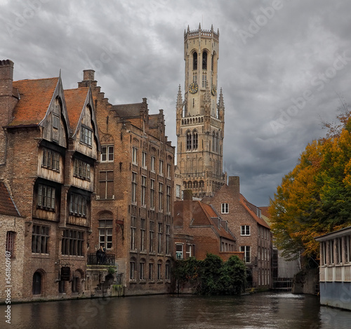 Beautiful canal view of the Belfry of Bruges in Autumn. photo