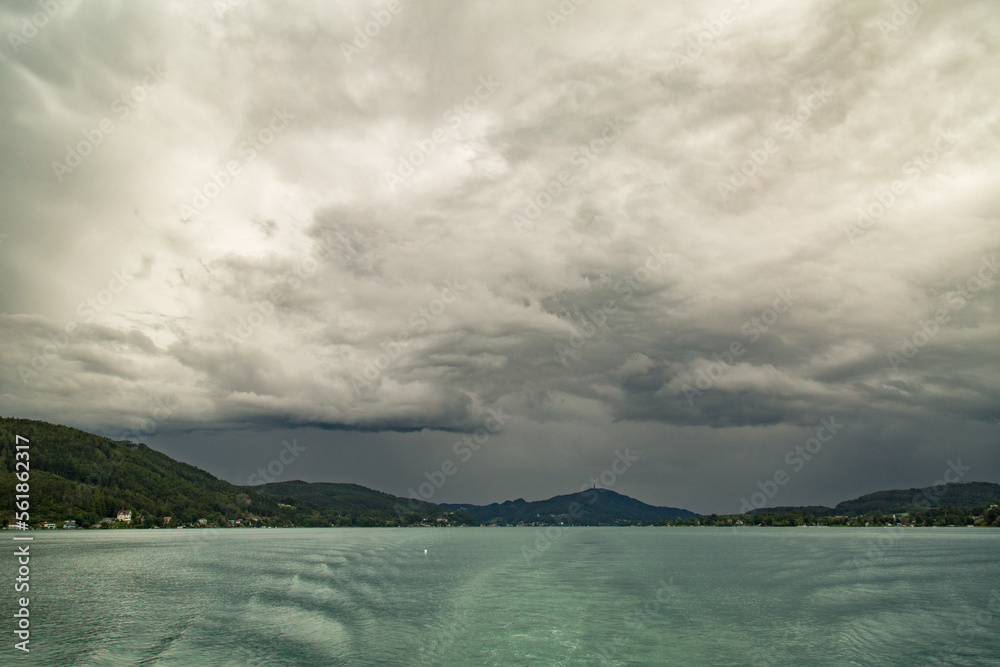 storm clouds over woerther lake in carinthia in the late summer.