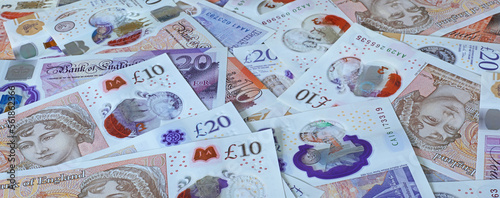 A plan view panorama of ten and twenty pound sterling bank notes.