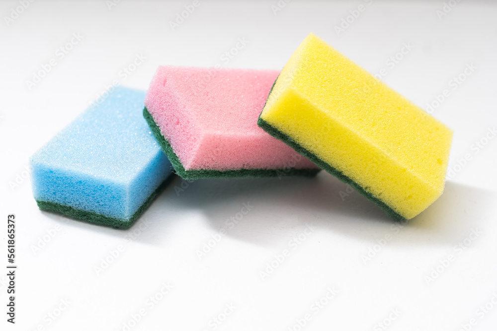 Kitchen dishcloth, cleanup concept, housework. Colorful kitchen sponges for cleaning close-up, housekeeping. - obrazy, fototapety, plakaty 