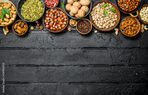 Assortment of different nuts in bowls.