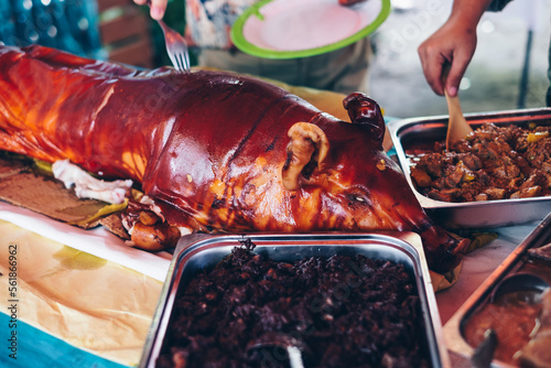 Buffet table of Filipino food like the popular and delicious roasted whole pig or 