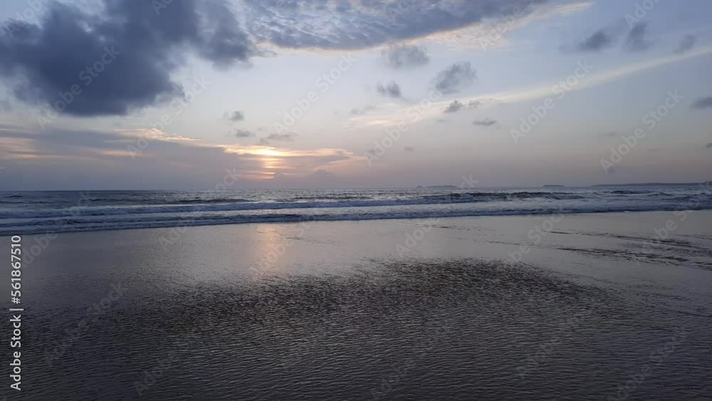 sunset reflections on the beach. sky reflections on the water. goa beach. sunset reflections on the beach. sky reflections on the water. goa beach.