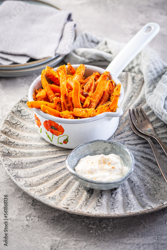 Homemade sweet potato and carrot fries with parmesan cheese and lemon yogurt dip
